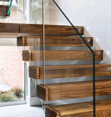 Cantilever Steel Stairs with Hardwood Finishes and Glass Balustrade at Byeways, Sarisbury Green, Hampshire for Reilly Developments